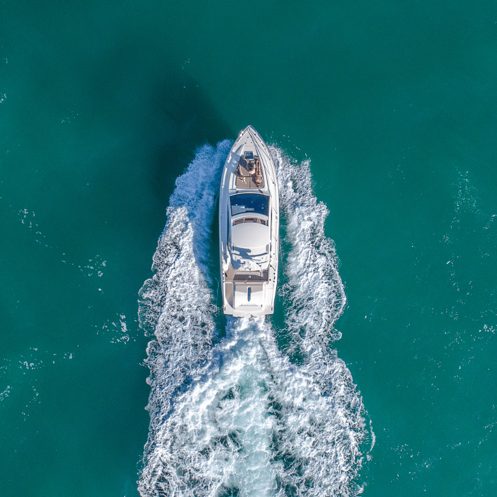 bird's eye view of a boat cruising through blue water